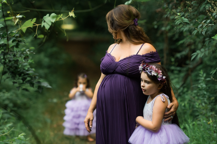 I was thrilled when Michelle from Pink Comb Studio reached out for her maternity photos. Following COVID-19 rule, keeping social distance I photographed Michelle and her two beautiful girls at Watchung Mountain NJ. With overcast weather three trees and grass showed such a rich deep green colors. I love bold rich colors in my photos as much as I love sunset golden hour. Michelle was just glowing and looked so beautiful. Was so happy to have such a beautiful mama in front of my camera before Michelle becomes mama of three girls. I can not wait to see her new baby girl and see her family grow. Michelle Surgent’s maternity session captured by Karis from heykaris.